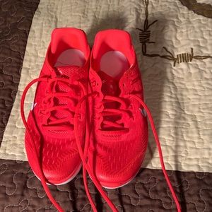 Youth Nike red running shoes size 4.